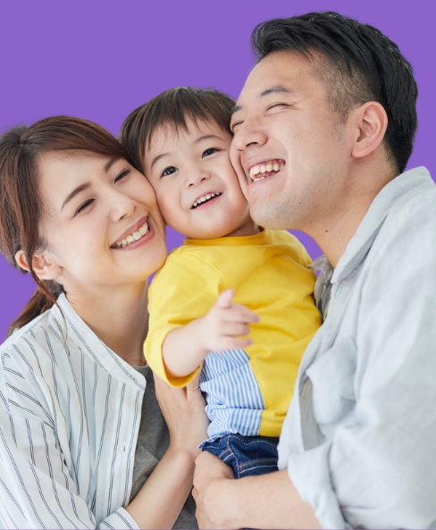 Photo of family smiling, banner for 'preventive care'